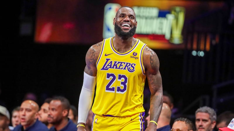 Los Angeles Lakers forward LeBron James (23) smiles after being fouled while shooting against...