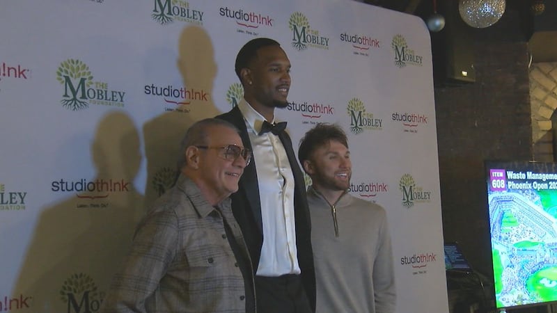 Cavs’ Evan Mobley poses for a picture with guests at his first “Beyond the Game Gala."