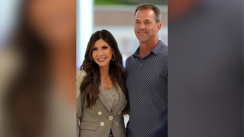 Homeland Security Secretary Kristi Noem left, poses with her husband Byron Noem, right, after...