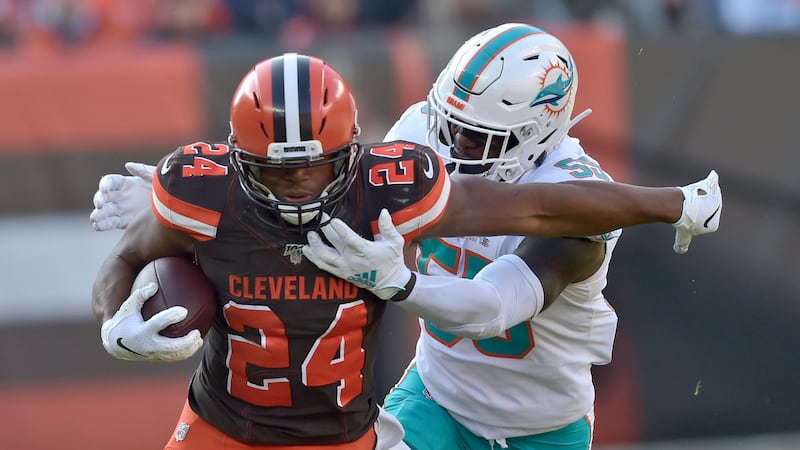 Cleveland Browns running back Nick Chubb (24) rushes against Miami Dolphins outside linebacker...