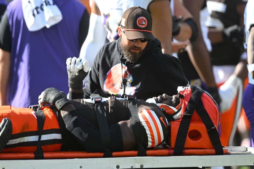 Cleveland Browns linebacker Jeremiah Owusu-Koramoah (6) is taken off the field during the...