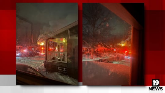 The Cleveland Fire Department rescued a woman from the roof of a house fire on Saturday morning.