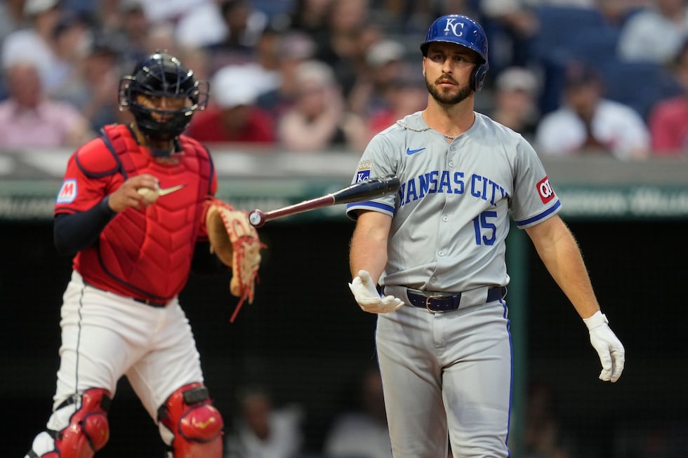 Kansas City Royals' Paul DeJong (15) flips his bat in front of Cleveland Guardians fourth...