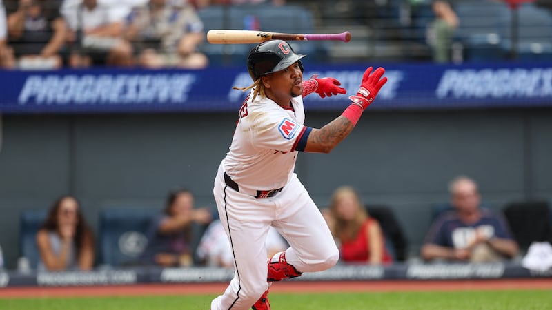 Cleveland Guardians' José Ramírez starts ti run after hitting a single against the Kansas City...