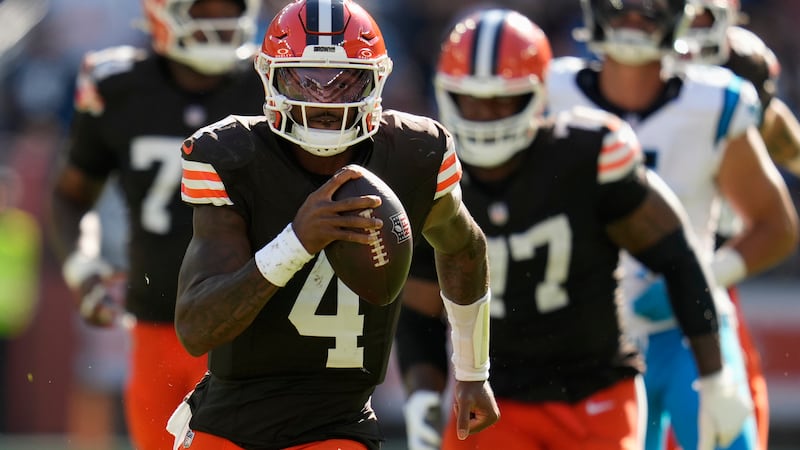 Cleveland Browns quarterback Deshaun Watson (4) runs with the ball against the Carolina...