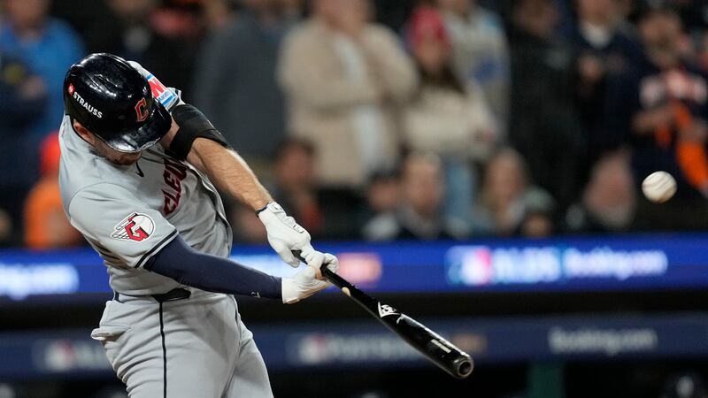 Cleveland Guardians' David Fry hits a two-run home run in the seventh inning during Game 4 of...