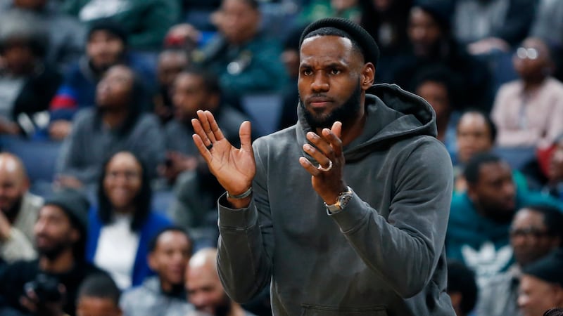 FILE - LeBron James watches his son Bronny play for Sierra Canyon as they compete against...