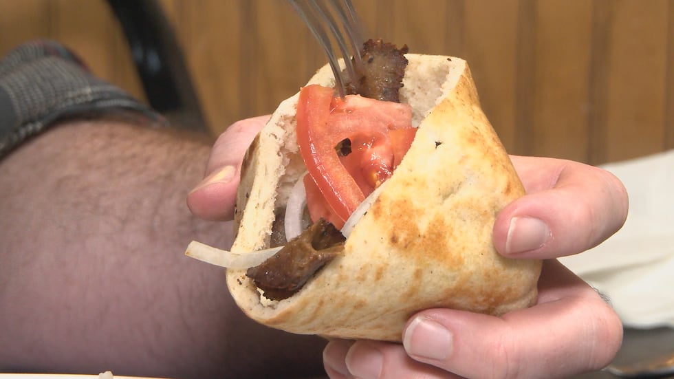 A warm, fresh gyro with meat cut straight from the spinner.
