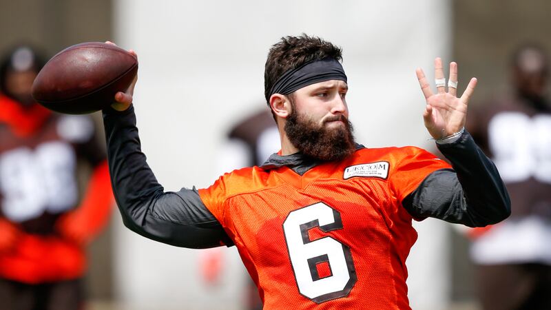 Cleveland Browns' Baker Mayfield throws a pass during an NFL football organized team activity...