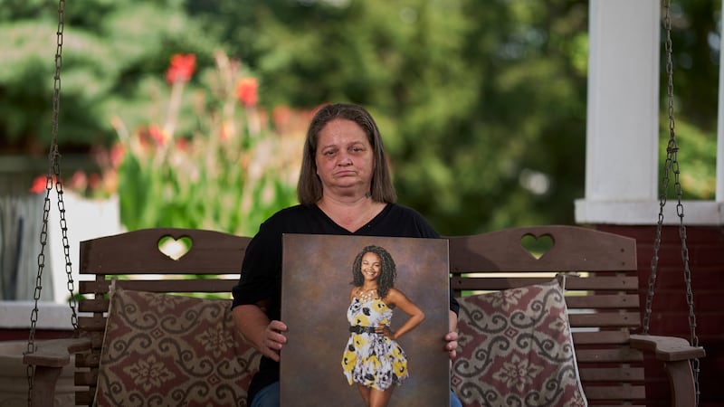 Christy Spivey poses with a portrait of her late daughter, Tasia Fortune, on Tuesday, Sept. 8,...