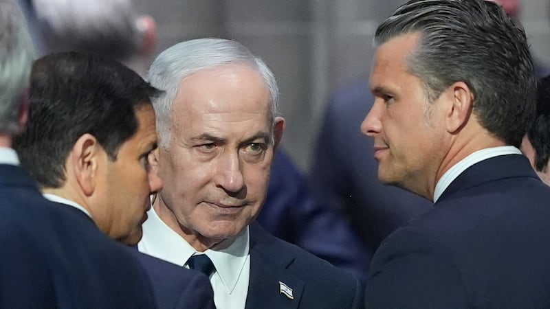 Israeli Prime Minister Benjamin Netanyahu, center, speaks to Secretary of Defense Pete...