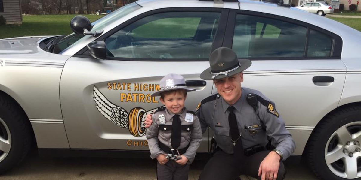 Ohio State Highway Patrol Trooper comforts child scared during traffic stop