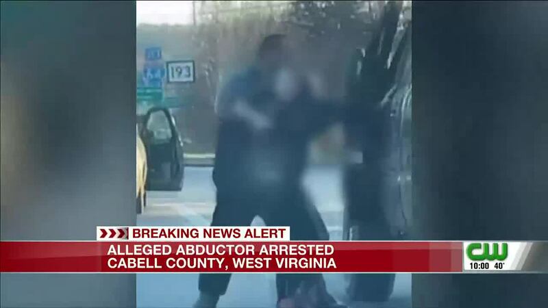 The video, shot by a woman in traffic, shows a young woman being dragged by a man out of a car...