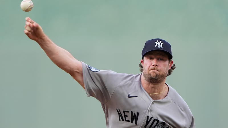 New York Yankees starting pitcher Gerrit Cole throws during the first inning of baseball game...