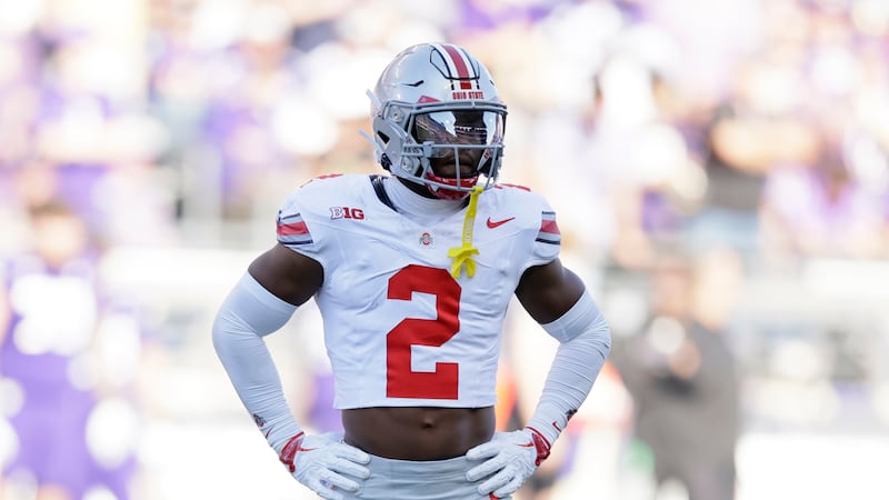 Ohio State safety Caleb Downs (2) stands on the field for the start of a play during the...