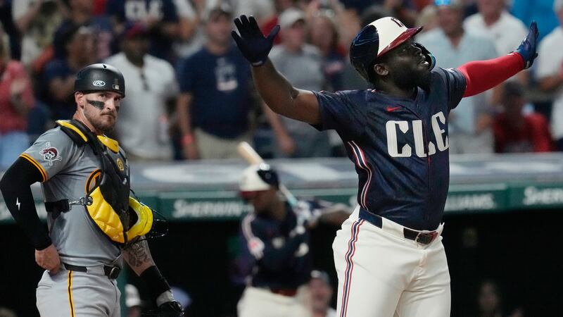 Cleveland Guardians' Jhonkensy Noel, right, celebrates in front of Pittsburgh Pirates catcher...