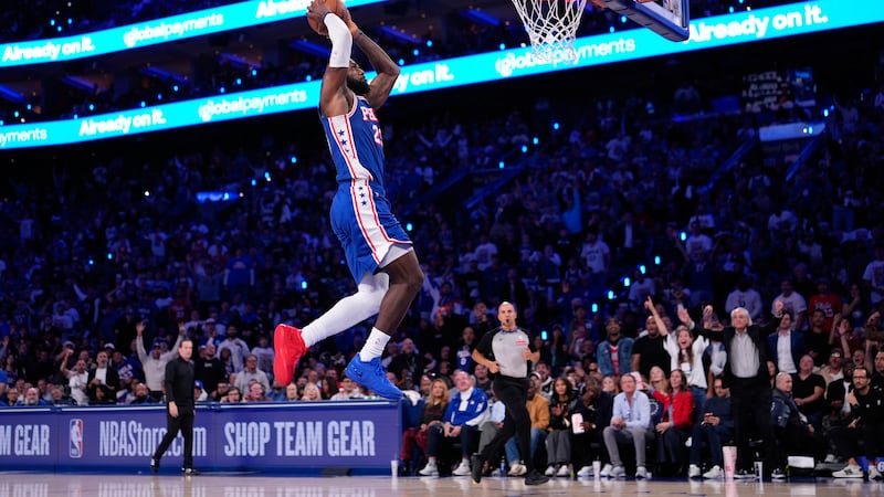 Philadelphia 76ers' LeBron James goes up for a dunk during the first half of an NBA basketball...