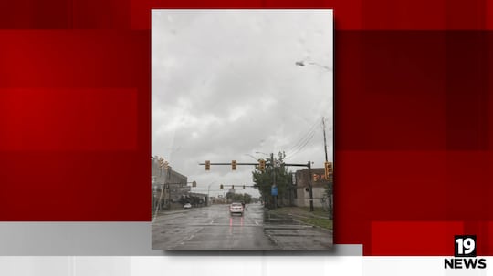 Multiple streetlights are in downtown Cleveland, heading toward University Heights.