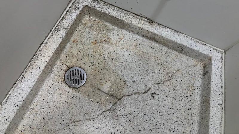 Black mold appears to grow in a shower at Hillcrest Hospital