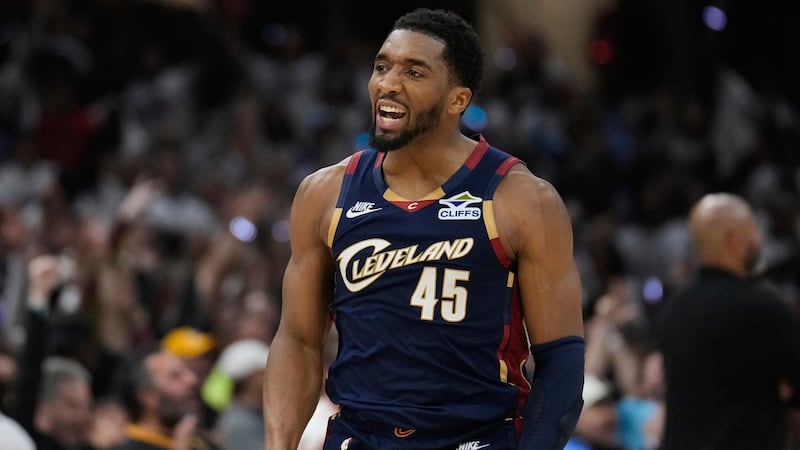 FILE - Cleveland Cavaliers' Donovan Mitchell (45) gestures after hitting a three-point basket...