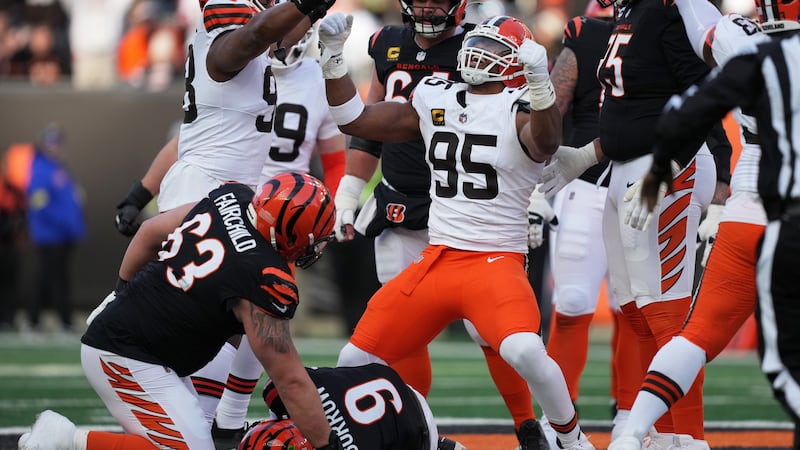 Cleveland Browns defensive end Myles Garrett (95) celebrates after sacking Cincinnati Bengals...
