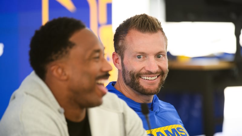 Los Angeles Rams head coach Sean McVay, right, looks defensive end Myles Garrett, center,...
