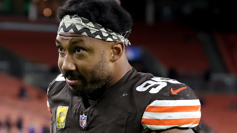 Cleveland Browns defensive end Myles Garrett (95) walks off of the field after an NFL football...