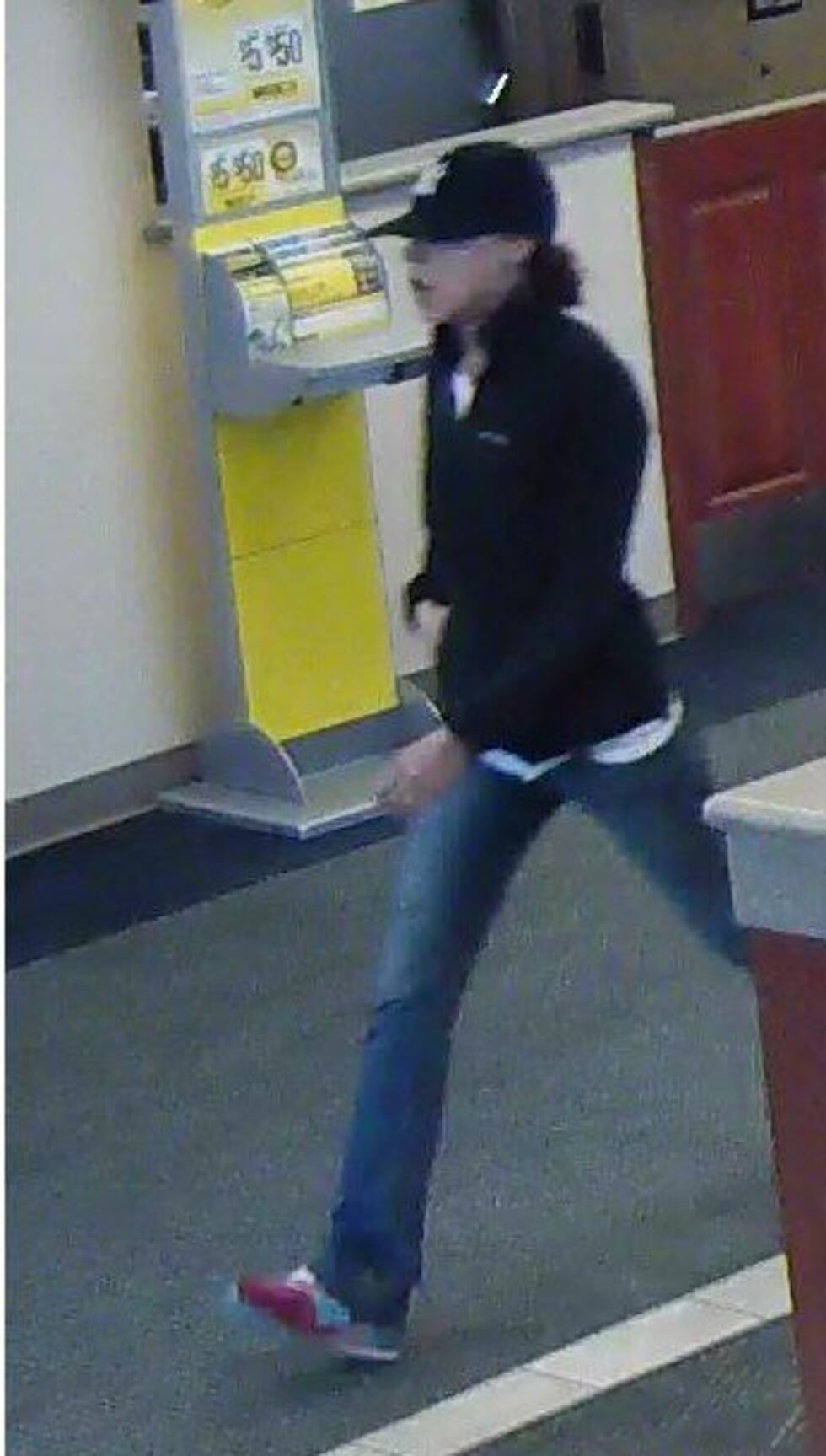Woman Robs Bank Woman robs bank wearing Yankee cap
