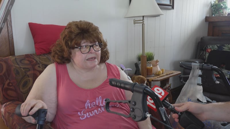 Nancy Dukes of Cleveland sitting her home without power on July 4.
