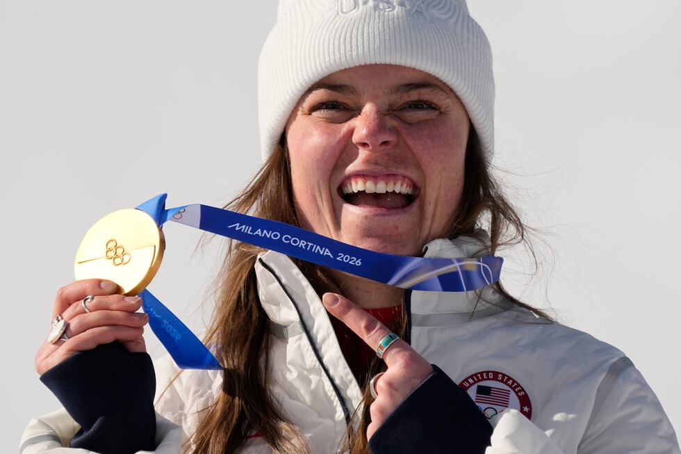 United States' Breezy Johnson shows her gold medal in the alpine ski women's downhill race, at...