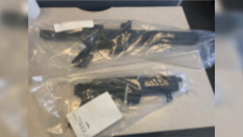 Akron police said officers seized these guns after a short chase Saturday night.