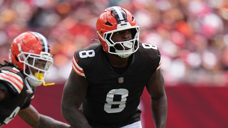 Cleveland Browns defensive end Jared Verse (8) rushes the passer during an NFL football game...