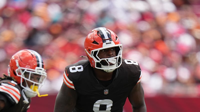 Cleveland Browns defensive end Jared Verse (8) rushes the passer during an NFL football game...