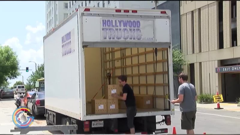 Film crew loading a production truck